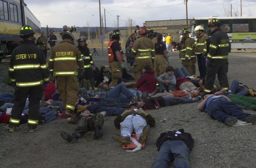 Rescue workers from several nearby fire departments monitor and evacuate simulated casualties of a train collision May 8 as part of Alaska Shield/Northern Edge 2007. The exercises, which are scheduled to run from May 7-18, will test military and civilian authorities throughout Alaska on all aspects of emergency preparedness as they respond to a variety of scenarios ranging from natural disasters to major accidents. (Staff Sgt. J.G. Buzanowski)