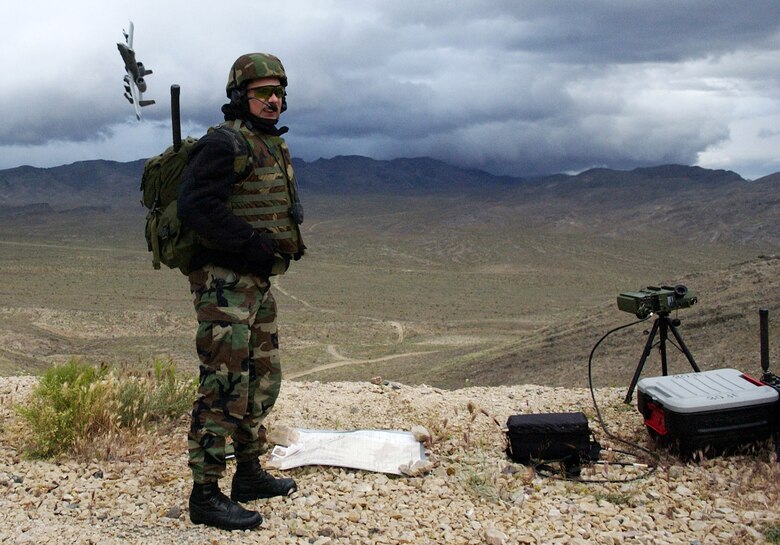 Master Sgt. Craig Hillsman provides a "cleared hot" call to an attacking A-10 Thunderbolt II during a training exercise at the Nevada Test and Training Range.  Sergeant Hillsman is a joint terminal attack controller instructor with the 6th Combat Training Squadron at Nellis Air Force Base, Nev.  JTACs are recognized throughout the U.S. military as experts in air-to-ground operations.  Once the JTAC receives authorization from the ground maneuver force commander, he can clear an aircraft to attack a desired target.  (U.S. Air Force photo/Master Sgt. Kevin J. Gruenwald)