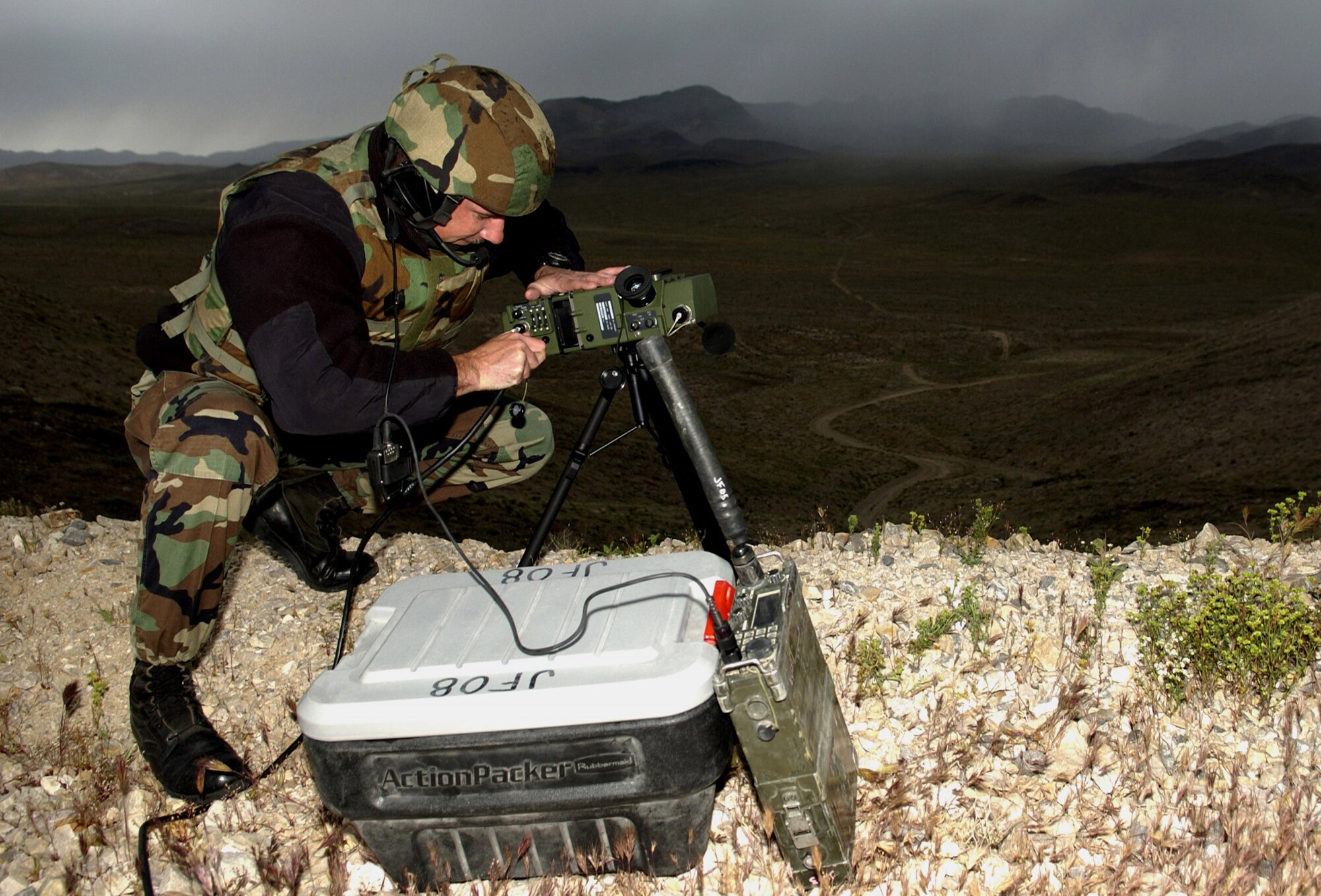 Master Sgt. Craig Hillsman assembles a ground laser target designator that he will use to mark targets for incoming aircraft providing close-air support during a training exercise at the Nevada Test and Training Range.  Sergeant Hillsman is a joint terminal attack controller instructor with the 6th Combat Training Squadron at Nellis Air Force Base, Nev.  A JTAC acts as a liaison between forces on the ground and aircraft working in support of those forces and provides target information prior to providing weapons release authority to the aircraft.  (U.S. Air Force photo/Master Sgt. Kevin J. Gruenwald)