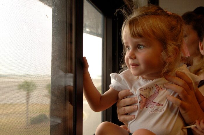 Andrea Wigdaho, 2, daughter of Capt. Erick Wigdaho, 15th Airlift Squadron, looks out the window as she waits eagerly for her father's plane to land May 5 at Charleston AFB.  Capt. Wigdaho returned from a four month deployent to Southwest Asia.  (U.S. Air Force photo/Staff Sgt. April Quintanilla)