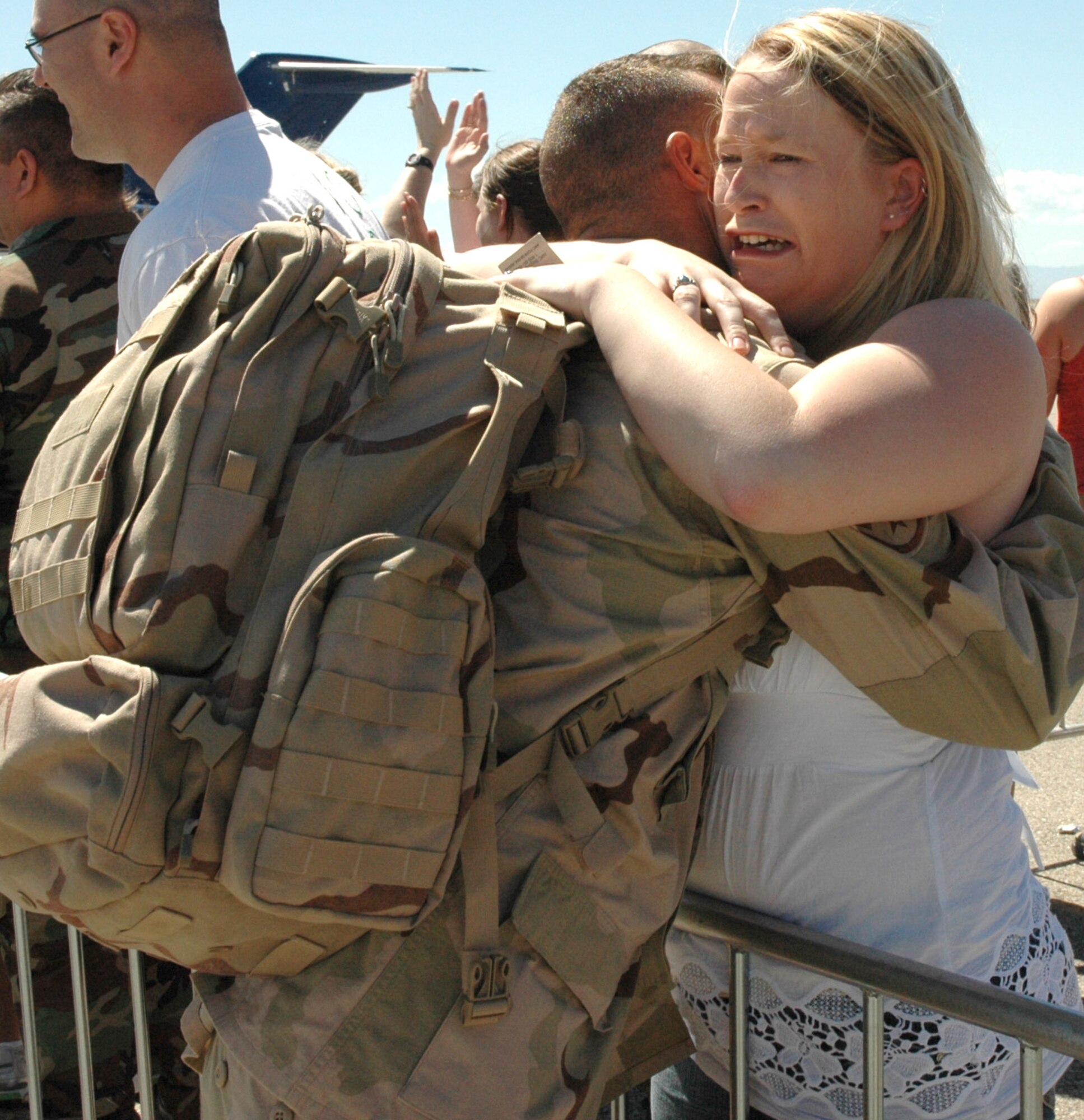 MOUNTAIN HOME AIR FORCE BASE, Idaho -- Amy Barber reacts as she welcomes home Staff Sgt. Stan Fossette after the sergeant and other members of the 366th Civil Engineer Squadron returned here May 8 after a nearly seven-month deployment to the Middle East. The base welcomed home 35 members from the squadron, who served at forward operating locations in Iraq and Afghanistan to build new work centers and living quarters and expand these bases to accommodate additional forces arriving in the region as part of the U.S. military’s ongoing troop surge. Air Force photo by Master Sgt. Brian S. Orban