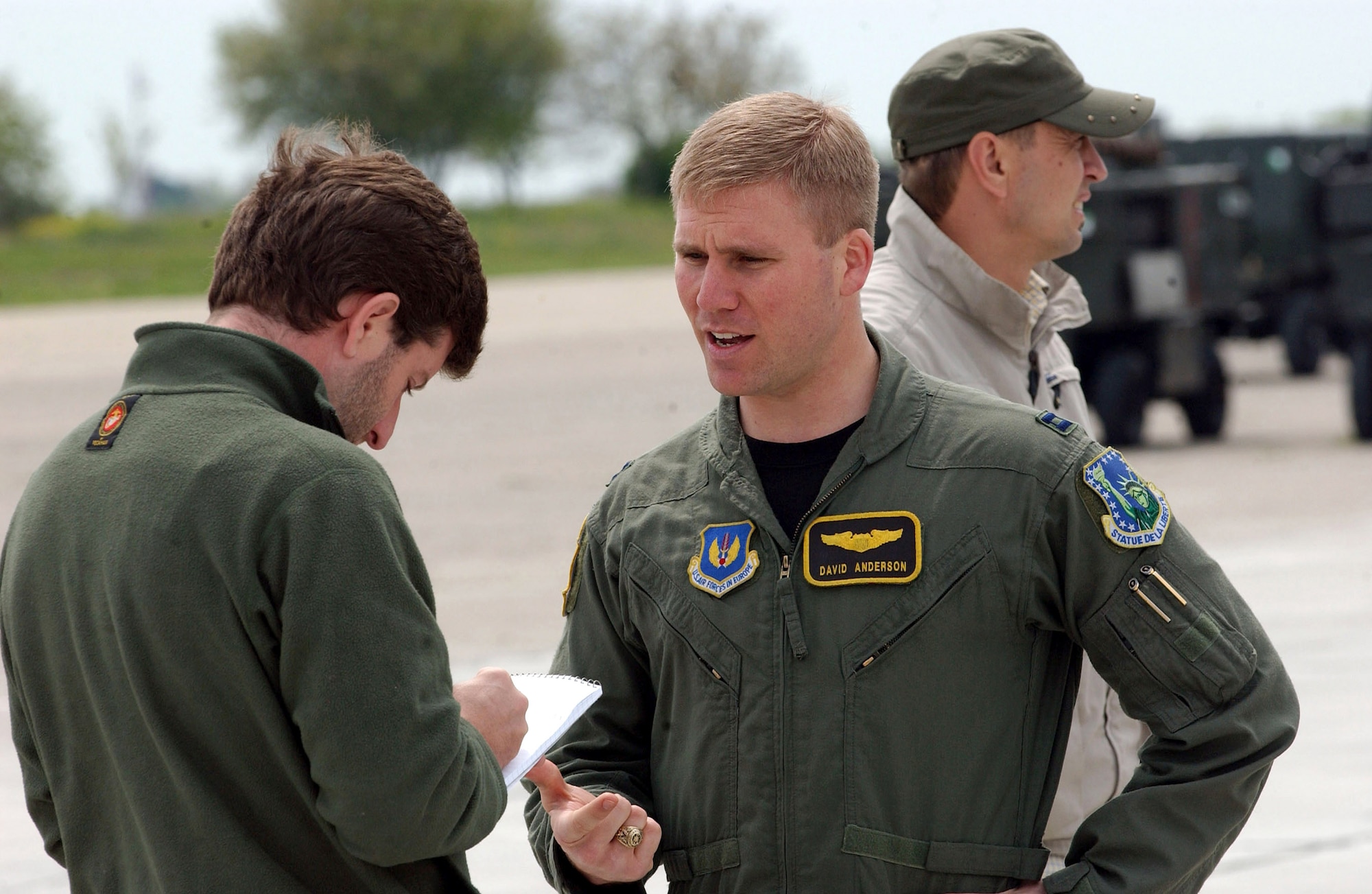 Capt. David Anderson conducts an interview with Stars and Stripes reporter Brian Mitchell during Exercise Sniper Lance 2007 May 1 at Mihail Kogalniceanu Air Base, Romania. The exercise is the first since U.S. and Romanian officials signed a Presence Agreement, which allowed for the presence of U.S. forces at Romanian bases beginning in 2007. Captain Anderson is an F-15 Eagle pilot with the 493rd Fighter Squadron from Royal Air Force Lakenheath, England. (U.S. Air Force photo/Master Sgt. Charles Tubbs)