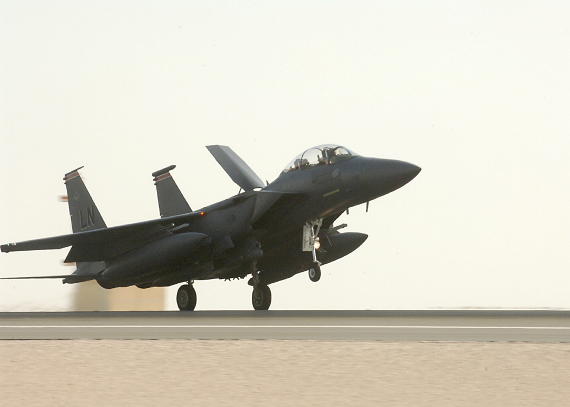 An Air Force F-15E Strike Eagle touches down after a mission in Southwest Asia. The F-15Es and other coalition aircraft flew 100 close-air-support missions in Iraq and Afghanistan May 8. (U.S. Air Force photo)