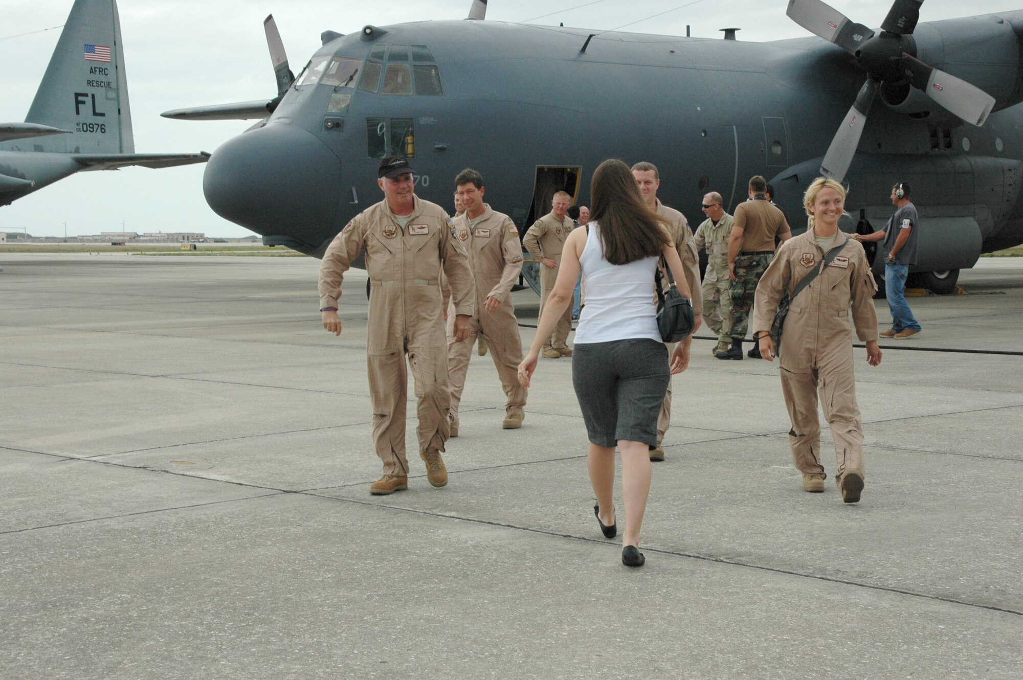 Air Force Reservist from the 920th Rescue Wing made a B-line toward their anxiously awaiting families May 8 after deplaning from the HC-130P/N which they piloted home to their Wing at Patrick Air Force Base, Fla. from a two-month deployment in Djoubiti, Africa.  The men and women from the 920th RQW provided combat search and rescue to the region which aids the Combined Joint Task Force - Horn of Africa mission in providing peace and stability to win the hearts and minds of natives who live in the Horn of Africa. (U.S. Air Force photo/Capt. Cathleen Snow)