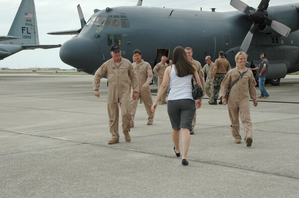 Air Force Reservist from the 920th Rescue Wing made a B-line toward their anxiously awaiting families May 8 after deplaning from the HC-130P/N which they piloted home to their Wing at Patrick Air Force Base, Fla. from a two-month deployment in Djoubiti, Africa.  The men and women from the 920th RQW provided combat search and rescue to the region which aids the Combined Joint Task Force - Horn of Africa mission in providing peace and stability to win the hearts and minds of natives who live in the Horn of Africa. (U.S. Air Force photo/Capt. Cathleen Snow)
