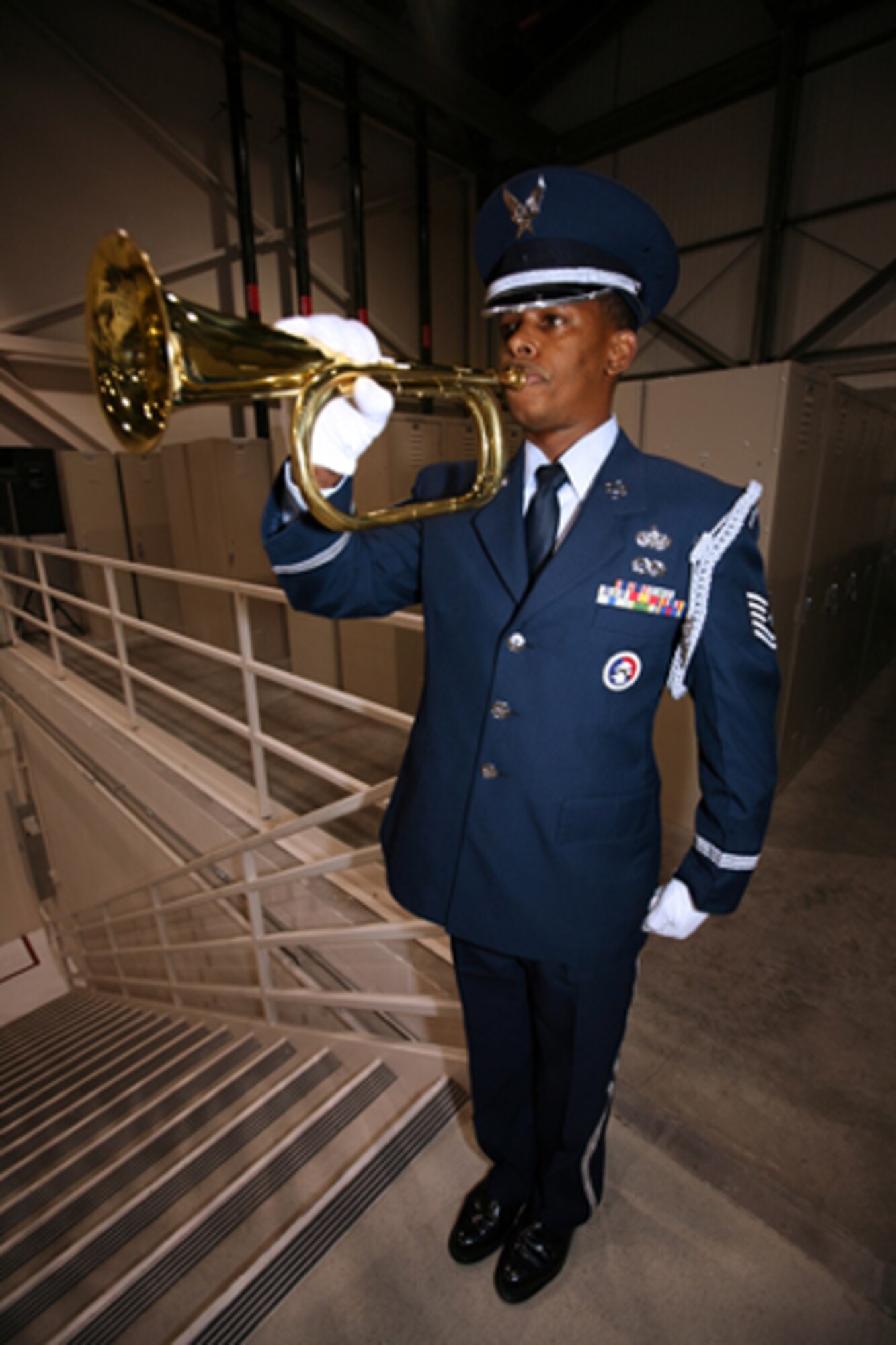 GRISSOM AIR RESERVE BASE, Ind. -- Tech. Sgt. Cortez Milton, Grissom Honor Guard member, pays tribute to fallen Indiana service members with the playing of Taps during a commander's call held during the May unit training assembly. Sergeant Milton is an electrical power-pro technician with the 434th Civil Engineering Squadron. (U.S. Air Force photo/Senior Airman Omar Delacruz)