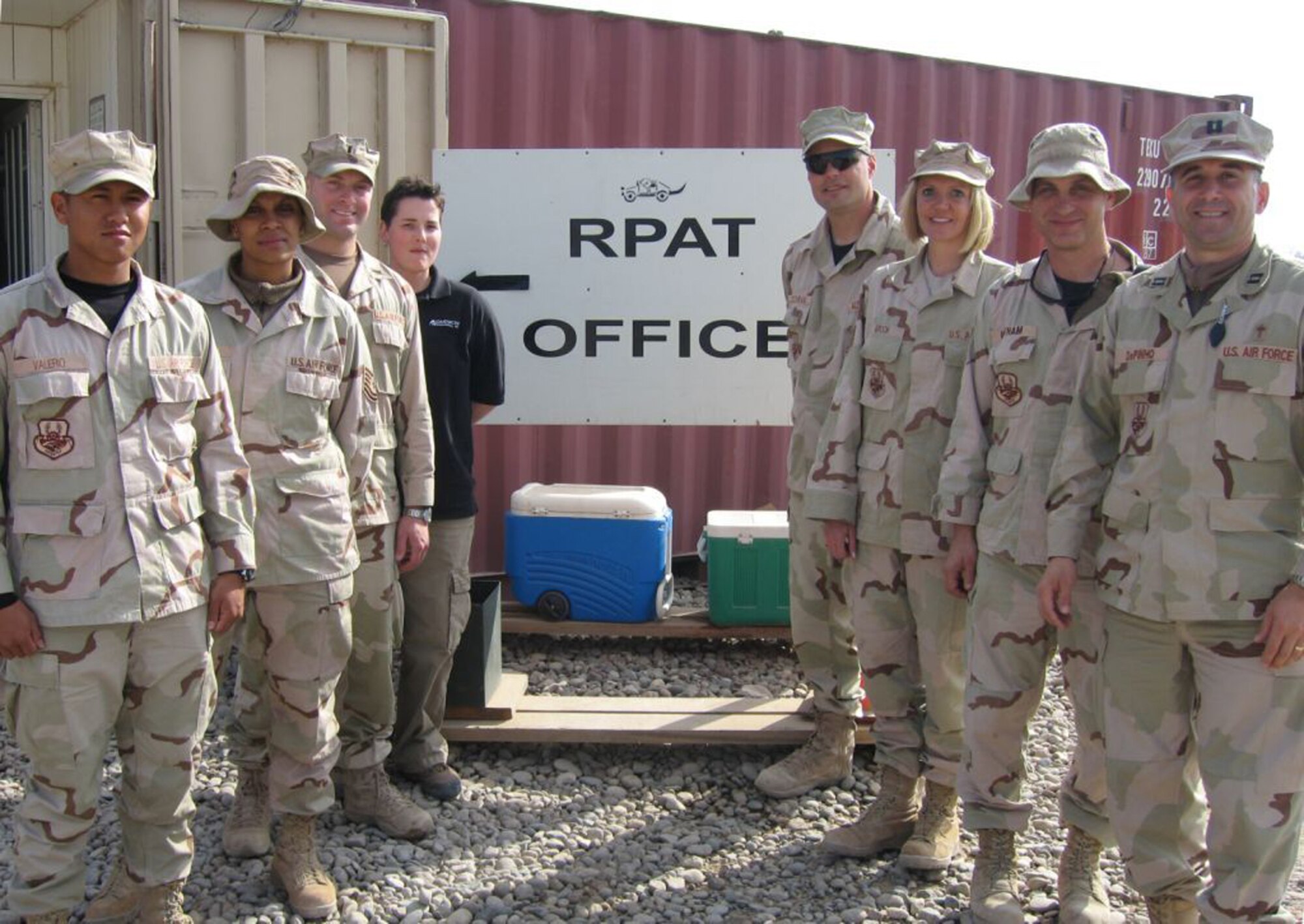 CONTINGENCY OPERATING BASE SPEICHER, Iraq -- Chap. (Capt.) David DePinho, (front-right,) a chaplain with the 332nd Air Expeditionary Wing, was inspired by the motivation shown by the men and women of the 732nd Expeditionary Logistics Readiness Squadron, Det 1 Retrograde Property Action Team or "RPAT" serving in "In-Lieu-Of", (ILO) positions for the Army as they process cargo and vehicles for movement by air instead of convoys, saving countless lives in the process. (Courtesy photo)