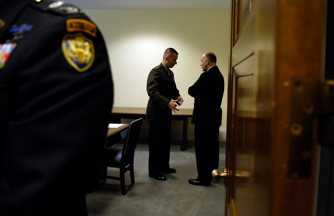 Chairman of the Joint Chiefs of Staff U.S. Marine Gen. Peter Pace speaks with Robert Rangel before testifying before the Senate Appropriations Committee in Washington, May 9, 2007.  