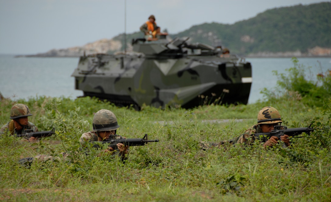 Infantrymen with the Royal Thai Marines take up positions during an amphibious raid exercise. The training was part of Cobra Gold 2007, an annual U.S. and Thai exercise designed to ensure regional peace and strengthen the ability of the Royal Thai Armed Forces to defend Thailand or respond to regional contingencies.
