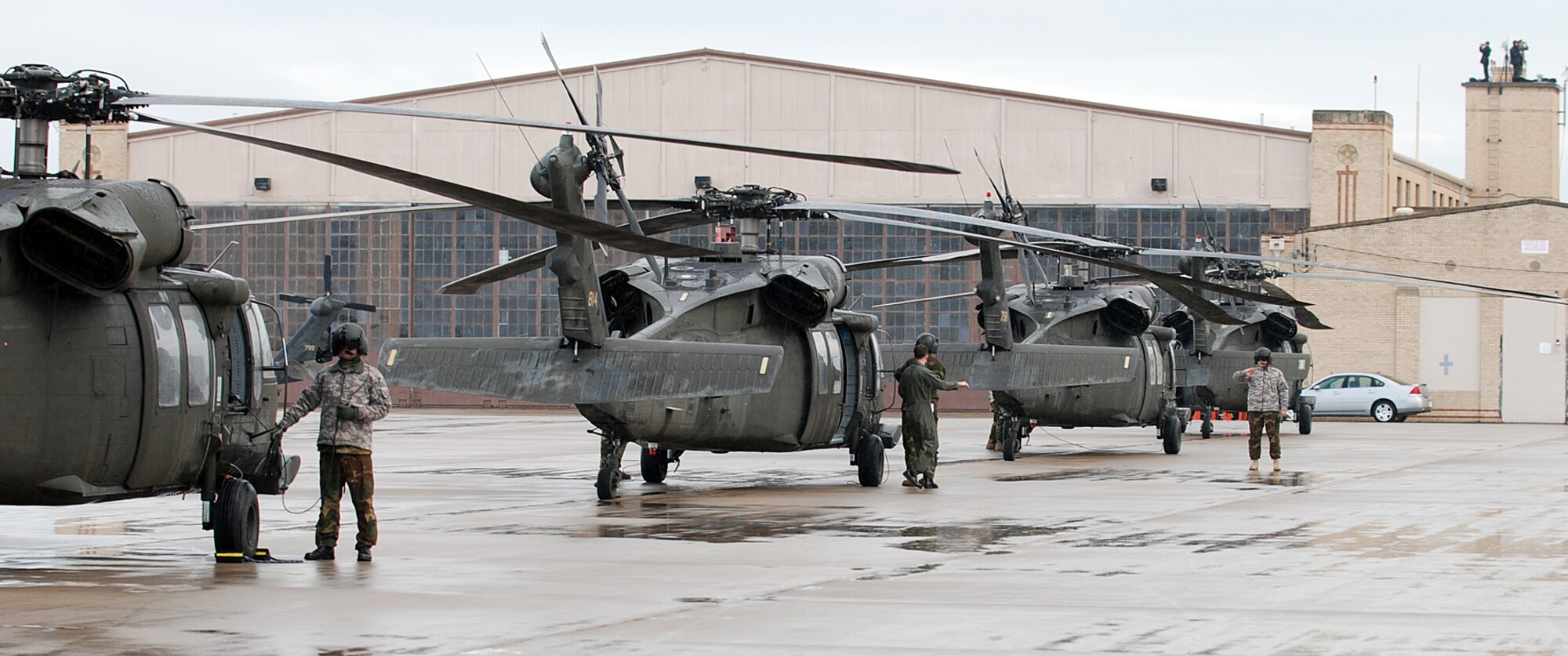 Helicopters line up on the flightline in preparation for the arrival of Air Force One May 9 at McConnell Air Force Base, Kan. The base served as a transit point for President George W. Bush who was on his way to meet with victims of the Greensburg, Kan., tornado disaster. Greensburg is approximately 120 miles west of the base and was struck by a tornado May 4. (Photo by Airman 1st Class Jessica Lockoski)