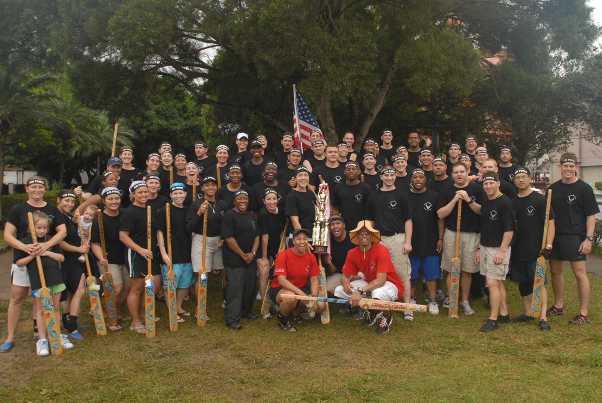 The “Shoguns” dragon boat teams, from Kadena Air Base, Japan, competed in the 33rd Annual Naha Dragon Boat races at Naha Port May 5. Here, the men's and women's teams pose with the women’s first place trophy. More than 50 teams, including eight military teams from U.S. bases on Okinawa, took part in the annual competition. Among the U.S. military teams, the Air Force finished second at 5:00.22 minutes in the men’s division. In the women’s division, the Air Force also finished second at 5:36.25 minutes. The women’s team came in first place of their heat and second place in the overall for the U.S. military forces women’s bracket. The men’s team came in second place for their heat and second place in the overall for the U.S. military forces men’s bracket.
(U.S. Air Force/Airman 1st Class Kasey Zickmund)