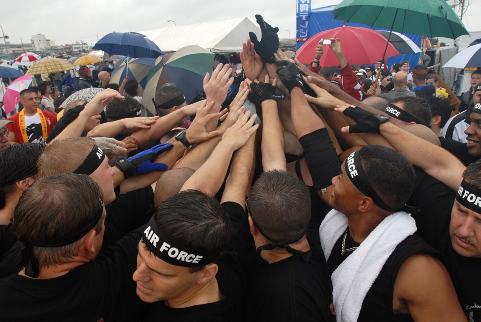 The Kadena men’s team brings all hands in to get motivated before their race. The men’s team placed third in their race and took second place overall in the U.S. military forces men’s bracket. The Kadena “Shoguns” dragon boat teams competed in the 33rd Annual Naha Dragon Boat races at Naha Port May 5. More than 50 teams, including eight military teams from U.S. bases on Okinawa, took part in the annual competition. Among the U.S. military teams, the Air Force finished second at 5:00.22 minutes in the men’s division. (U.S. Air Force/Airman 1st Class Kasey Zickmund)