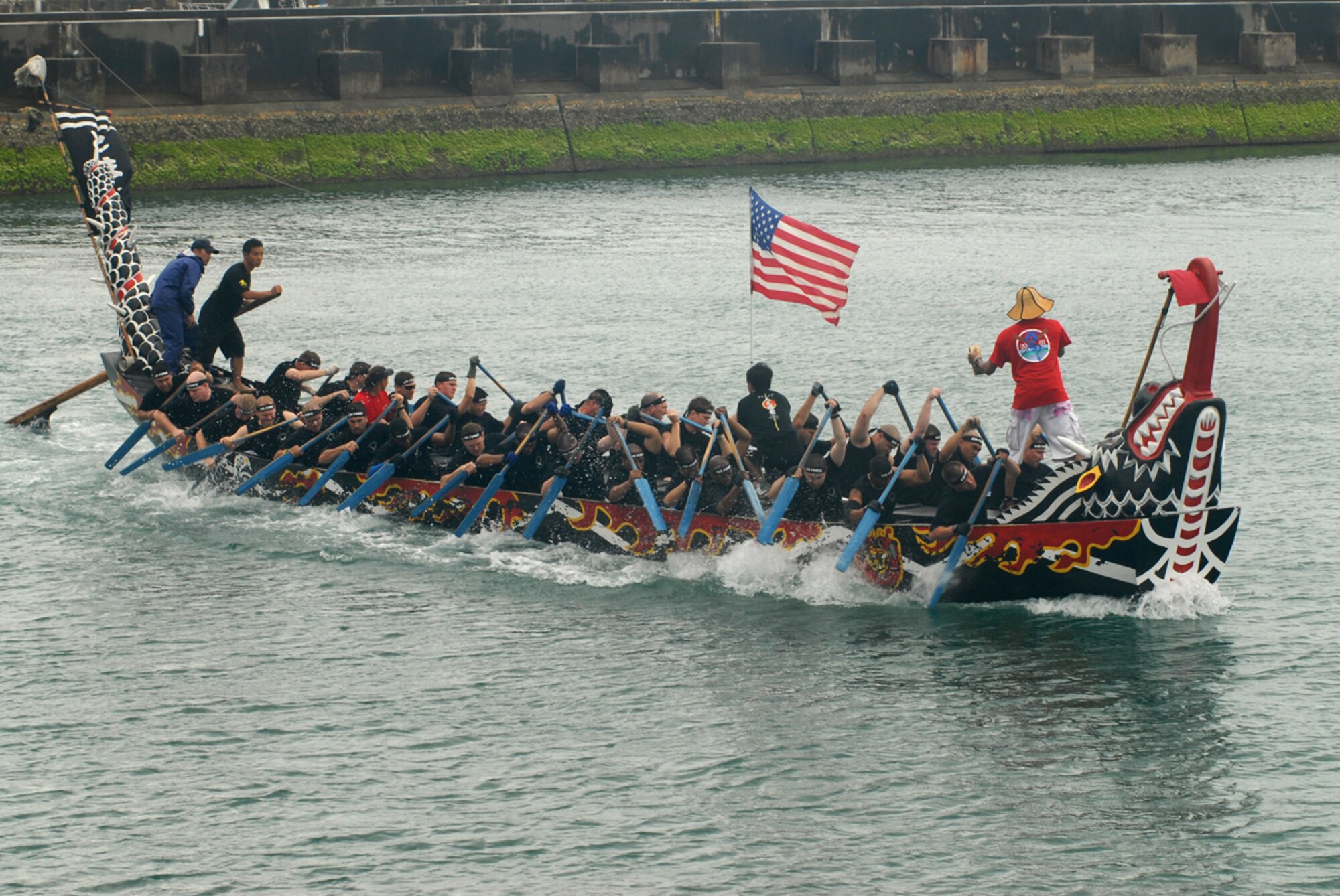 The Kadena “Shoguns” dragon boat men's team tries to row their way ahead of the Navy and the Japan Ground Self-Defense Force teams in the 33rd Annual Naha Dragon Boat races at Naha Port May 5.  Two teams from Kadena Air Base, Japan -- a men's and women's team -- were part of more than 50 teams, including eight military teams from U.S. bases on Okinawa, that took part in the annual competition. Among the U.S. military teams, the Air Force finished second at 5:00.22 minutes in the men’s division.  (U.S. Air Force/Airman 1st Class Kasey Zickmund)