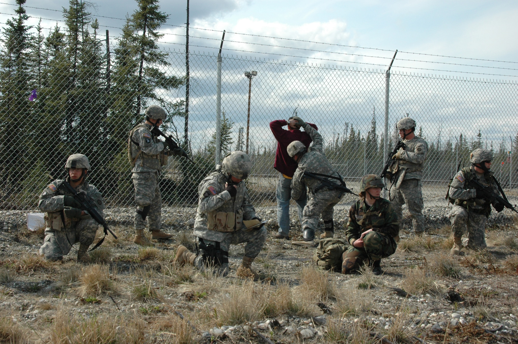North Pole, Alaska – An Airman and Soldiers contain a suspected terrorist after finding an improvised explosive devise while searching his vehicle during an Entry Control Point stop.  The ECP was established by members of the Nebraska National Guard and Alaska Air National Guard as part of an exercise conducted during Alaska Shield / Northern Edge 07.  Exercise Alaska Shield / Northern Edge 07 is a state of Alaska / US Northern Command sponsored homeland defense and defense support of civil authorities exercise; part of the national-level Ardent Sentry / Northern Edge 07 exercise.  Photo by Chief Mass Communications Specialist Greg Bingaman.