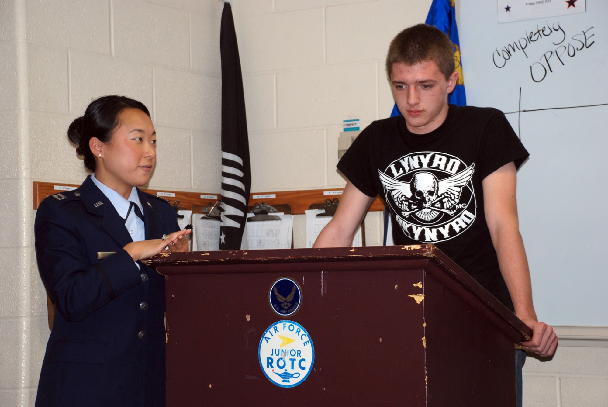 Taylor Lewis, a Junior Reserve Officer Training Cadet, shares his thoughts in front of his class during a debate for a class exercise being taught by Capt. Nora Cho, 22nd Air Refueling Wing Judge Advocate May 1 at Derby High School. On Law Day, Captain Cho teaches the students about the rights and privileges that youths have as U.S. citizens. (U.S. Air Force photo by Airman 1st Class Jessica Lockoski, 22nd ARW Public Affairs)