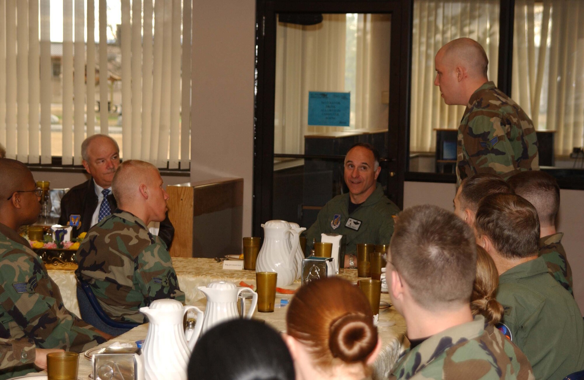 EIELSON AIR FORCE BASE, Alaska -- Airman 1st Class Lance Egan, 354th Communications Squadron, speaks with Secretary of the Air Force Michael W. Wynne during an open forum for Airman at the Two Seasons Dining Facility on May 09. The 21st Secretary of the Air Force is currently touring the Pacific Region to introduce his top priorities for the Air Force -- winning the war on terrorism, fostering mutual integrity and respect, and revitalizing for the service's aging infrastructure and fleet. (U.S. Air Force photo by Airman 1st Class Jonathan Snyder) 