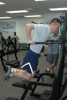 YOUNGSTOWN AIR RESERVE STATION, OH — Air Force Reserve Airman 1st Class Jeff Smith, an integrated avionics systems specialist with the 910th Maintenance Squadron, performs a dip on a strength training machine at the base fitness center as part of a unit fitness relay during the May UTA. The participating four-person teams competed for unit pride, an event trophy, individual prizes and as part of preparation for the upcoming Fit to Fight fitness testing. U.S. Air Force photo/Tech. Sgt. Bob Barko Jr.  