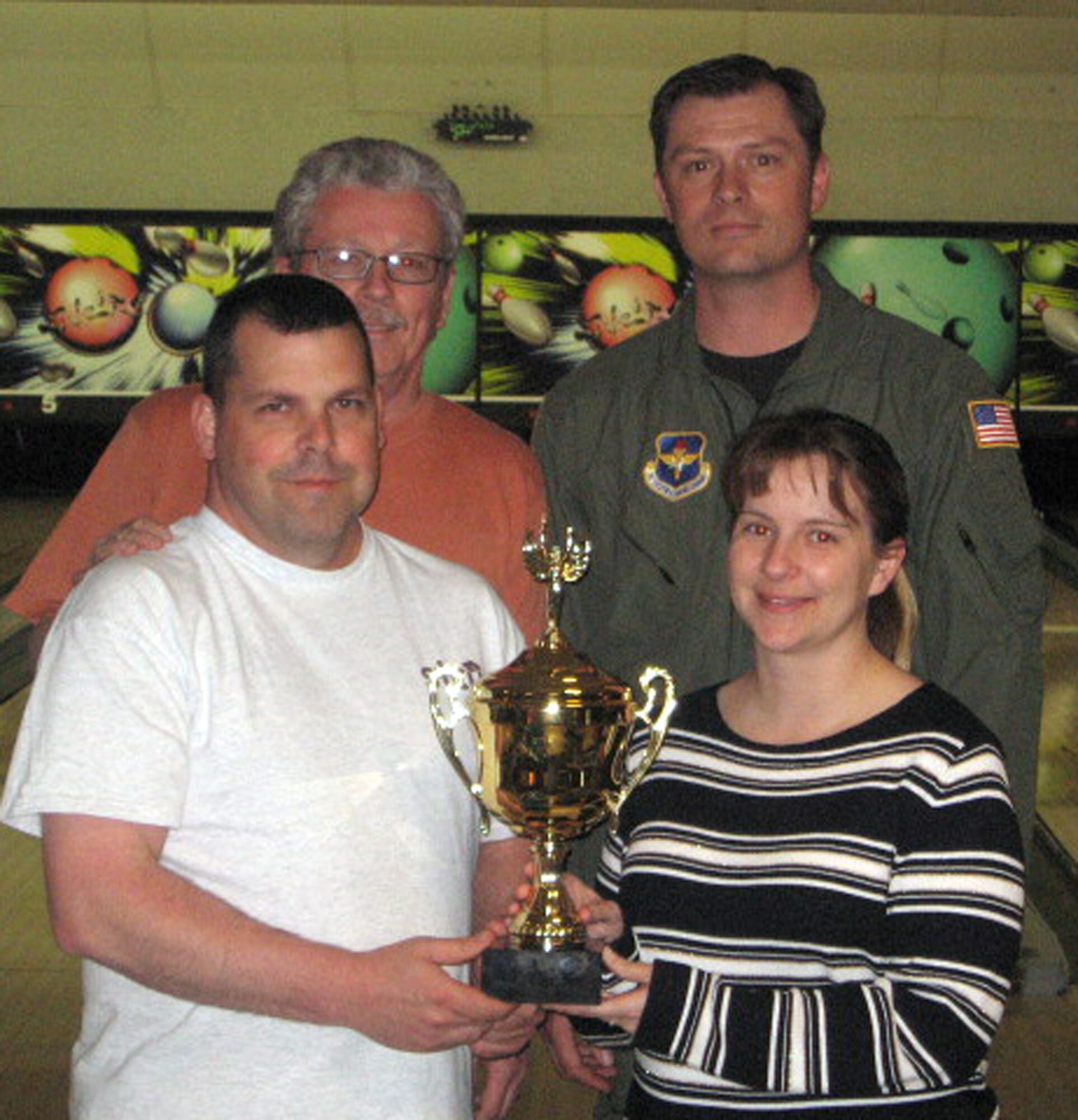 FAIRCHILD AIR FORCE BASE, Wash. – Clockwise from left front: Tech. Sgt. Jeff Hammond, David Wooten, Jim Bratsveen and Tara Funderburg pose with their first place trophy. The 336th Training Group team also included Master Sgt. Cory Edmiston, Staff Sgt. Michael Brown, Senior Airman Brian Whitmoyer, Senior Airman Claude Brown and Alicha Harris. (U.S. Air Force photo/Jason McCathren)