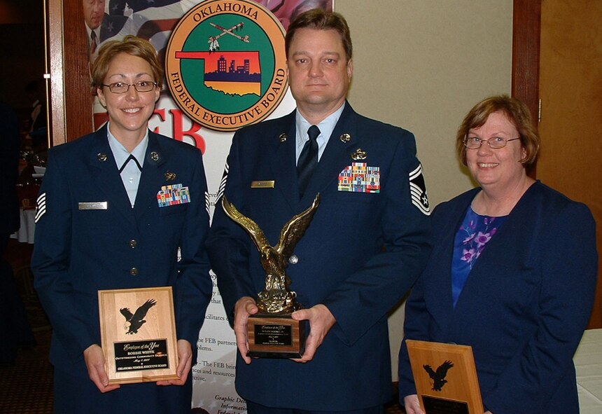 Tech Sgt. Bobbie White, 71st Mission Support Squadron readiness NCO, Senior Master Sgt. Nolen Moore Jr., 71st MSS 71st superintendent and Mary Loveless, 71st Communications Squadron telecommunications specialist, display the awards they received Monday at  the 2007 Public Service Recognition Awards luncheon. (U.S. Air Force photo by Capt. Lawrence Fiala)
