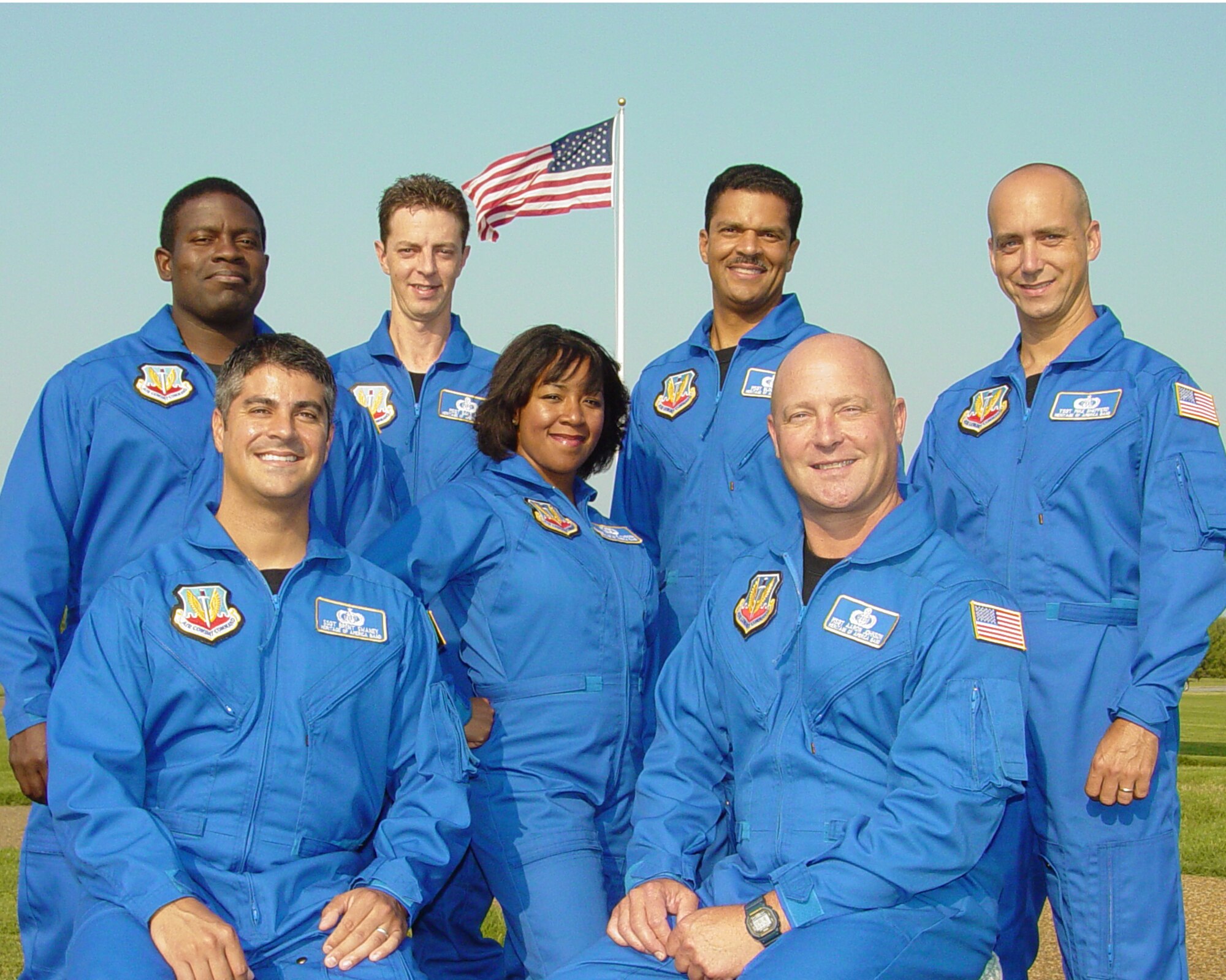 The USAF Heritage of America Band popular music component ensemble, Blue Aces poses at Memorial Park, Langley Air Force Base, Virginia.