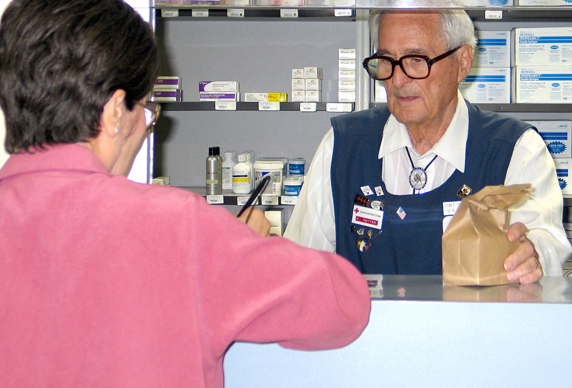FAIRCHILD AIR FORCE BASE, Wash. -- Retired Col. Francis Potter refills a prescription at the refill pharmacy here May 2. Colonel Potter has volunteered at the Fairchild pharmacy for the past 24 years, and served in the Air Force from 1943-1969. “I like to keep in touch with the people,” said Colonel Potter when asked why he volunteers. “I like to remain a part of the military.” (U.S. Air Force photo/Staff Sgt. Connie L. Bias) 