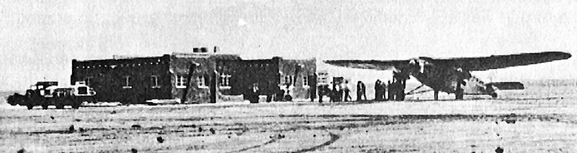 Passengers board an airplane parked next to the original Albuquerque Airport terminal. The building was finished May 1, 1928 and is now the Sandia Area Federal Credit Union on Wyoming Boulevard.  Courtesy photo