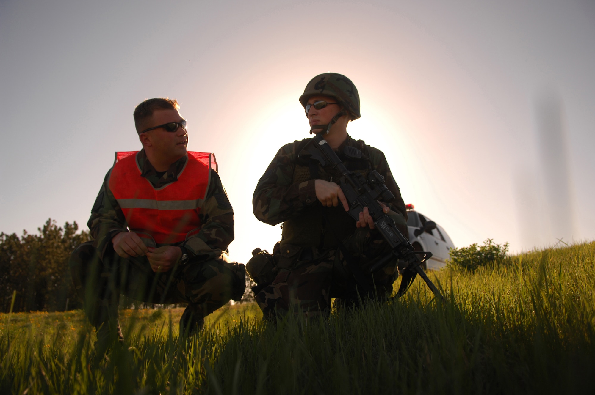 MINOT AIR FORCE BASE, N.D. -- Tech. Sgt. Gerald Sullivan, 91st Security Forces Group exercise evaluator, reviews security procedures with Airman Ray Johnson, 91st Missile Security Forces Squadron, during a simulated attack on a missile launch facility May 9. Minot Air Force Base conducts exercises like this to enhance its response capability. (U.S. Air Force photo by Airman 1st Class Joe Rivera)