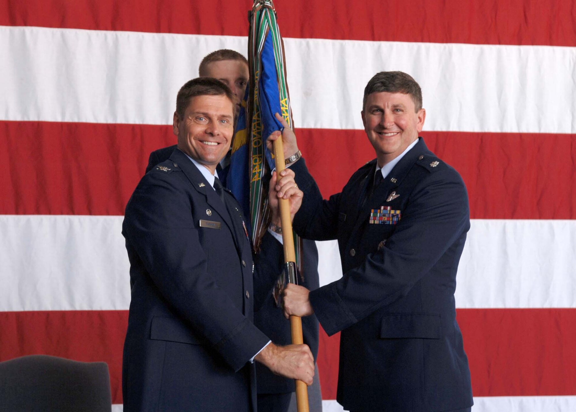 Lieutenant Col. Thomas Lennon assumed command of the 49th Fighter Training Squadron Thursday at a ceremony at Hangar 4. He is pictured receiving the guideon from Colonel Eric Theisen, 14th Operations Group commander.