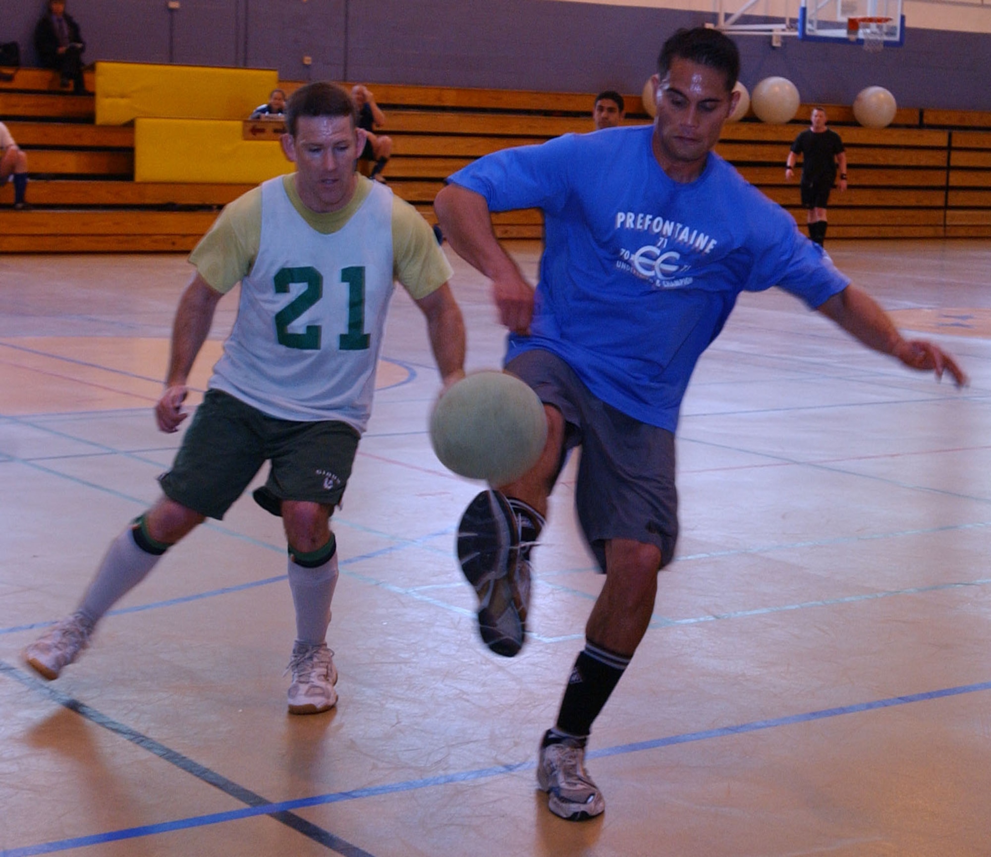 Eddie Gray controls the ball for the 95th RS while Michael Murphy looks on. (U.S Air Force photo by Airman Brad Smith) 