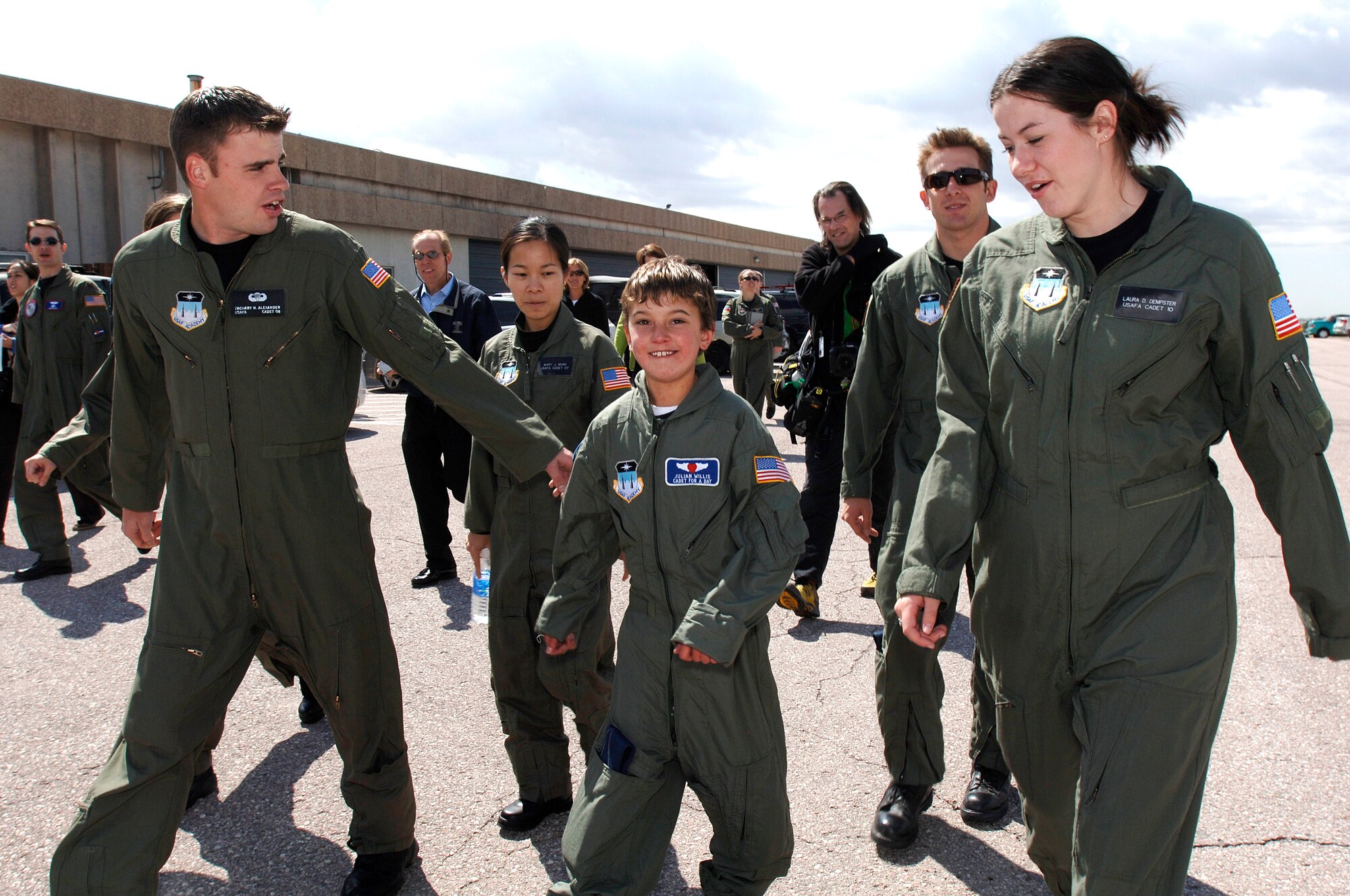 Ten-year-old Julian Willis walks out to the parachute landing zone during his three-day visit to the U.S. Air Force Academy, Colo. The Make-a-Wish Foundation and the Air Force Academy made Julian a "Cadet for a Day". Cadets have sponsored 22 children since the program started in 2000. (U.S. Air Force photo/Mike Kaplan)