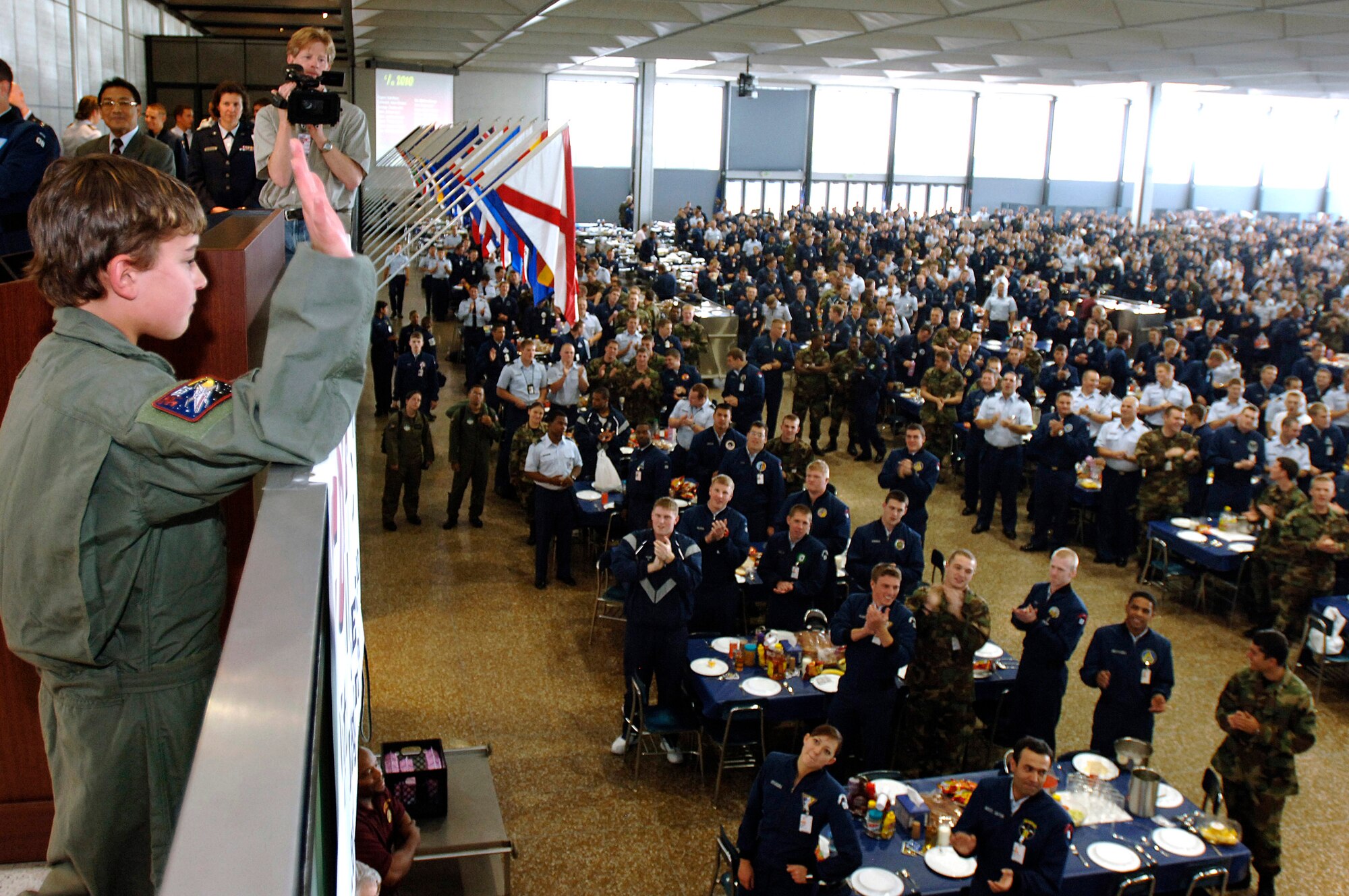 Ten-year-old Julian Willis receives a standing ovation from 4,000 cadets May 4 during lunch at the U.S. Air Force Academy, Colo. The Make-a-Wish Foundation and the Air Force Academy made Julian a "Cadet for a Day." Cadets have sponsored 22 children since the program started in 2000. (U.S. Air Force photo/Mike Kaplan)