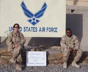 KANDAHAR AIRFIELD, AFGHANISTAN -- Maj. Margaret O’Hara, 91st Space Wing Safety Office, and Tech. Sgt. Ernest Powers, 5th Services Squadron, send Minot greetings from their deployed location. Both Airmen are currently deployed in support of Operation Enduring Freedom.(Courtesy photo)
