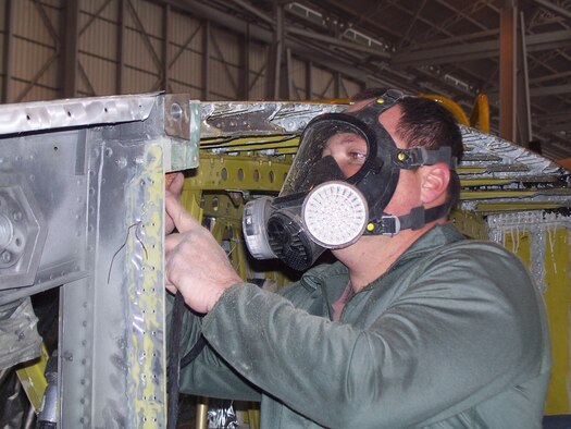 Tech. Sgt. Richard Clearwater, a 653rd Combat Logistics Support Squadron fuel systems craftsman, prepares a fuel tank for the installation of new rainbow fittings. (Air Force photo)