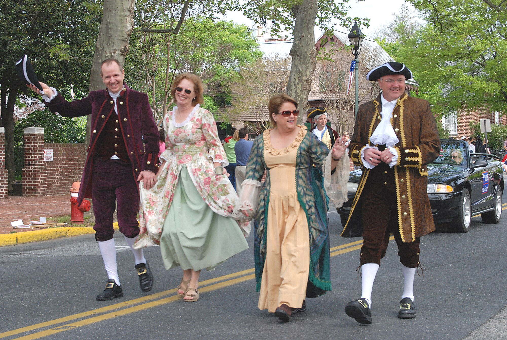Dover Air Force Base's 512th Airlift Wing Vice Commander Col. David H. Wuest, his wife Sharon, and 436th Airlift Wing Mission Support Group Commander Col. Vic Sowers, and his wife Pam, celebrate local history in a march down State Street for the 2007 Old Dover Days parade May 5.  