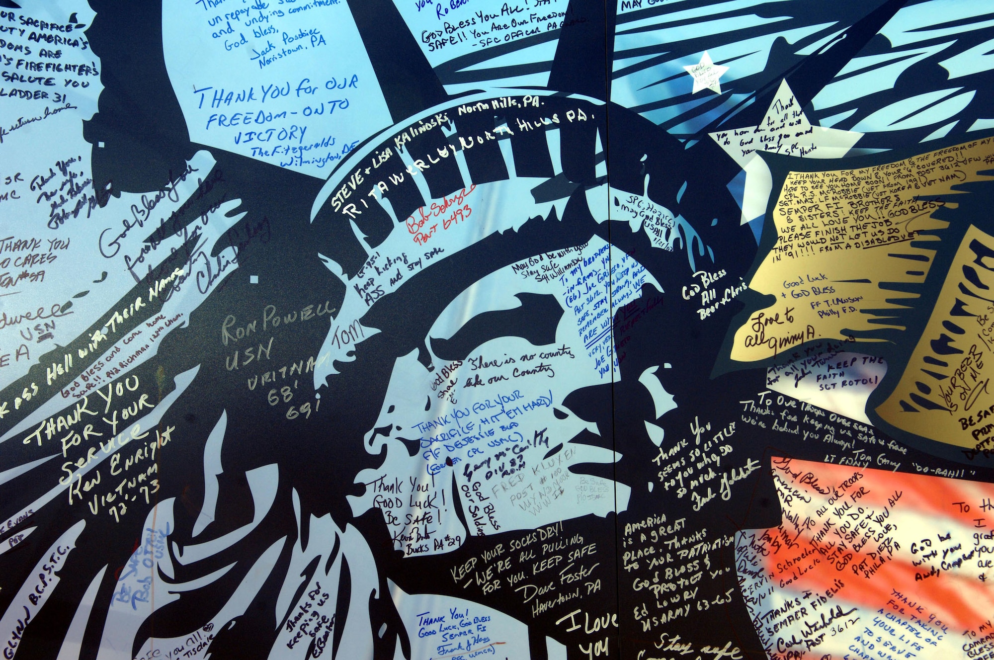 A close look at the donated mural reveals the messages and signatures of the well wishers--many of whom are former service members from all branches of the military.  (U.S. Air Force photo/Staff Sgt. Kevin Tomko)