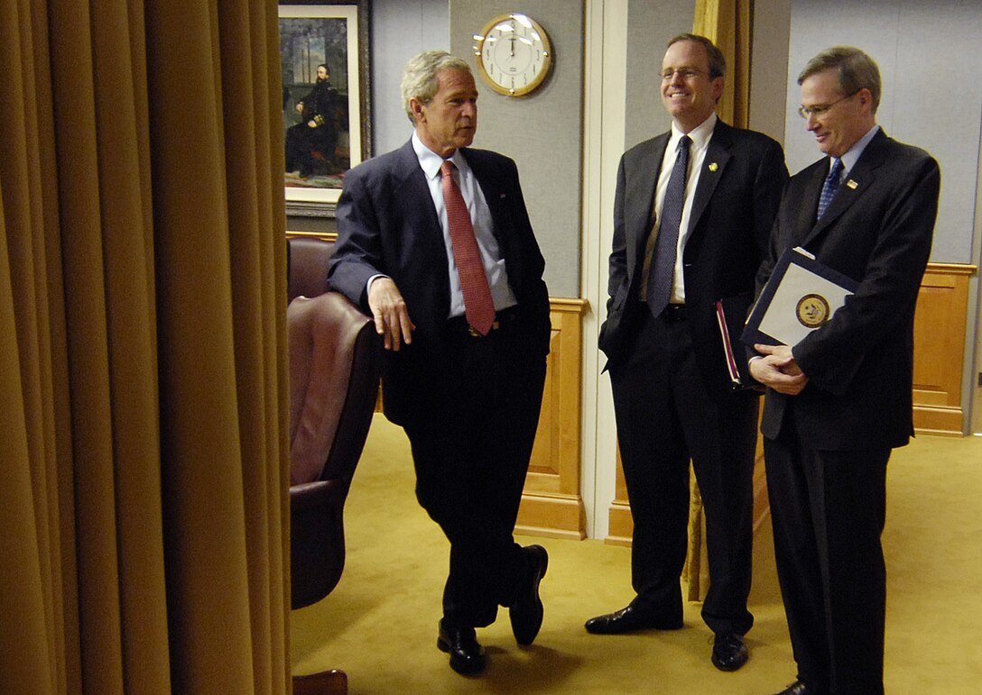 President George W. Bush talks with National Security Advisor, Steve Hadley, and Counselor to the President of the United States, Dan Bartlett, after a meeting with senior defense leaders at the Pentagon, May 10, 2007.	
