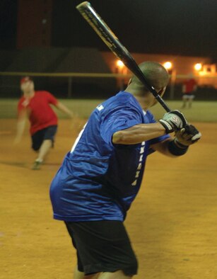 Jonathon Payton of the 36th SVS prepares to bat as the pitcher launches the ball.
