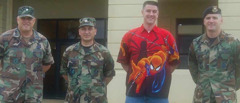 ANDERSEN AIR FORCE BASE, Guam 00 Capt. William Lujan and Jeffrey Crandell stand with Lt. Col. James Hudson, Air Force Office of Special Investigations Det. 602 commander, and Maj. Erik Goepner, 36th Security Forces Squadron commander, after being recognized as the Vigilant Warrior. (U.S. Air Force photo by Tech. Sgt. Brian Bahret)