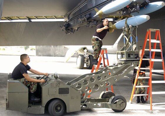 Airmen from the 36th Munitions Squadron load weapons on a B-52. 