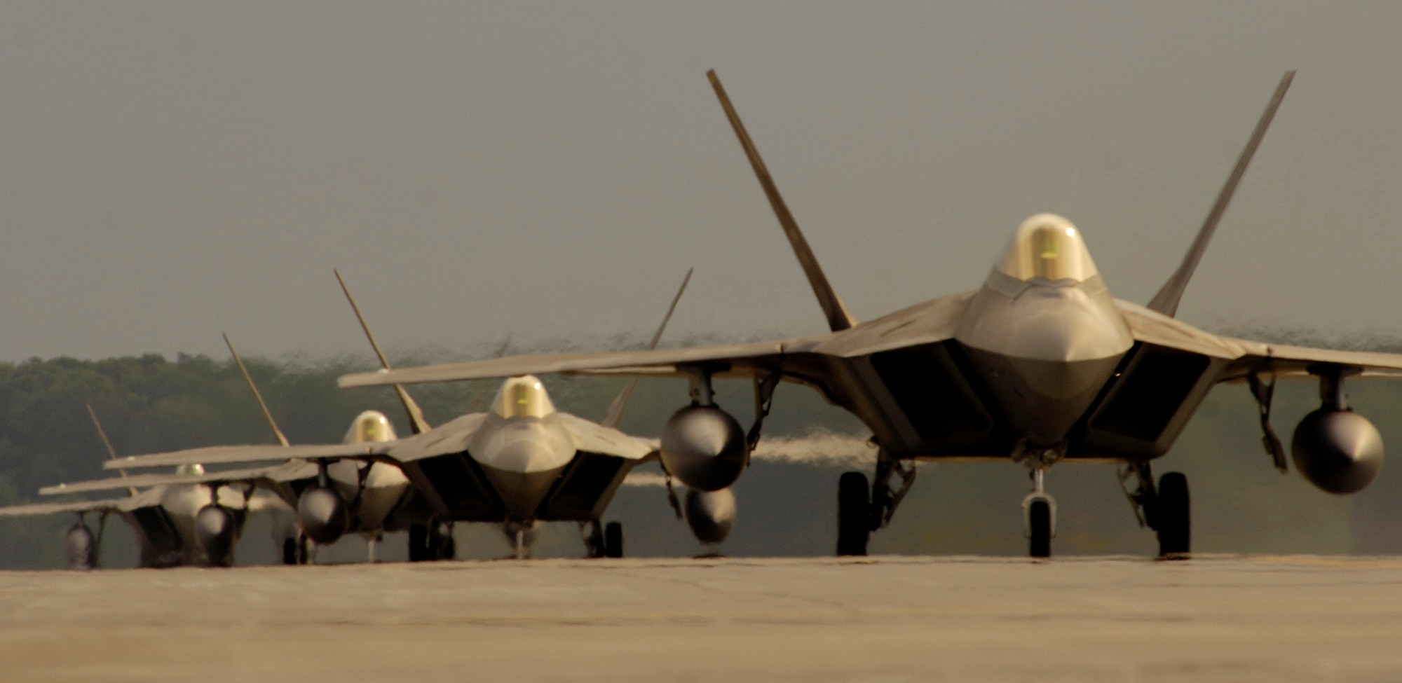 27th Fighter Squadron F-22A Raptors taxi here May 11. The 27th FS deployed to Kadena Air Base, Japan, for three months. The Pacific theater mission marked the Raptor’s first overseas Air and Space Expeditionary Force deployment. (U.S. Air Force photo/Staff Sgt. Samuel Rogers)