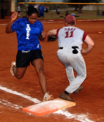 A 36th Services Squadron member runs to first base during a game with the 36th Munitions Squadron team #1. The 36 MUNS team defeated the 36 SVS team 22-2. 