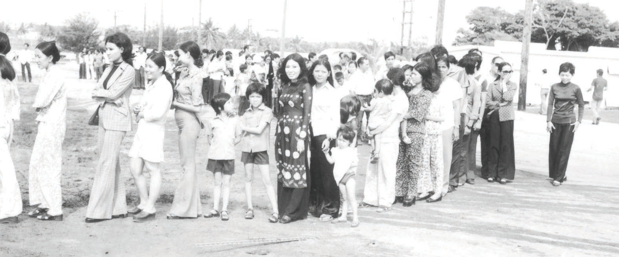 New Life refugees waiting in line at Andersen's “Tin City” barracks. (Photo courtesy of the 36th Wing History Office)