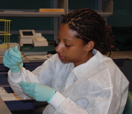 Senior Airman Carmen Williams, laboratory technician, pours specimens to be mailed to a reference laboratory. The 36 MDG laboratory technicians; Capt. Devona Luna, Tech. Sgt. Marlon Pugh, Staff Sgt. Leah Heegard and Senior Airman Carmen Williams play a vital role in the detection and prevention of disease in our Andersen community.