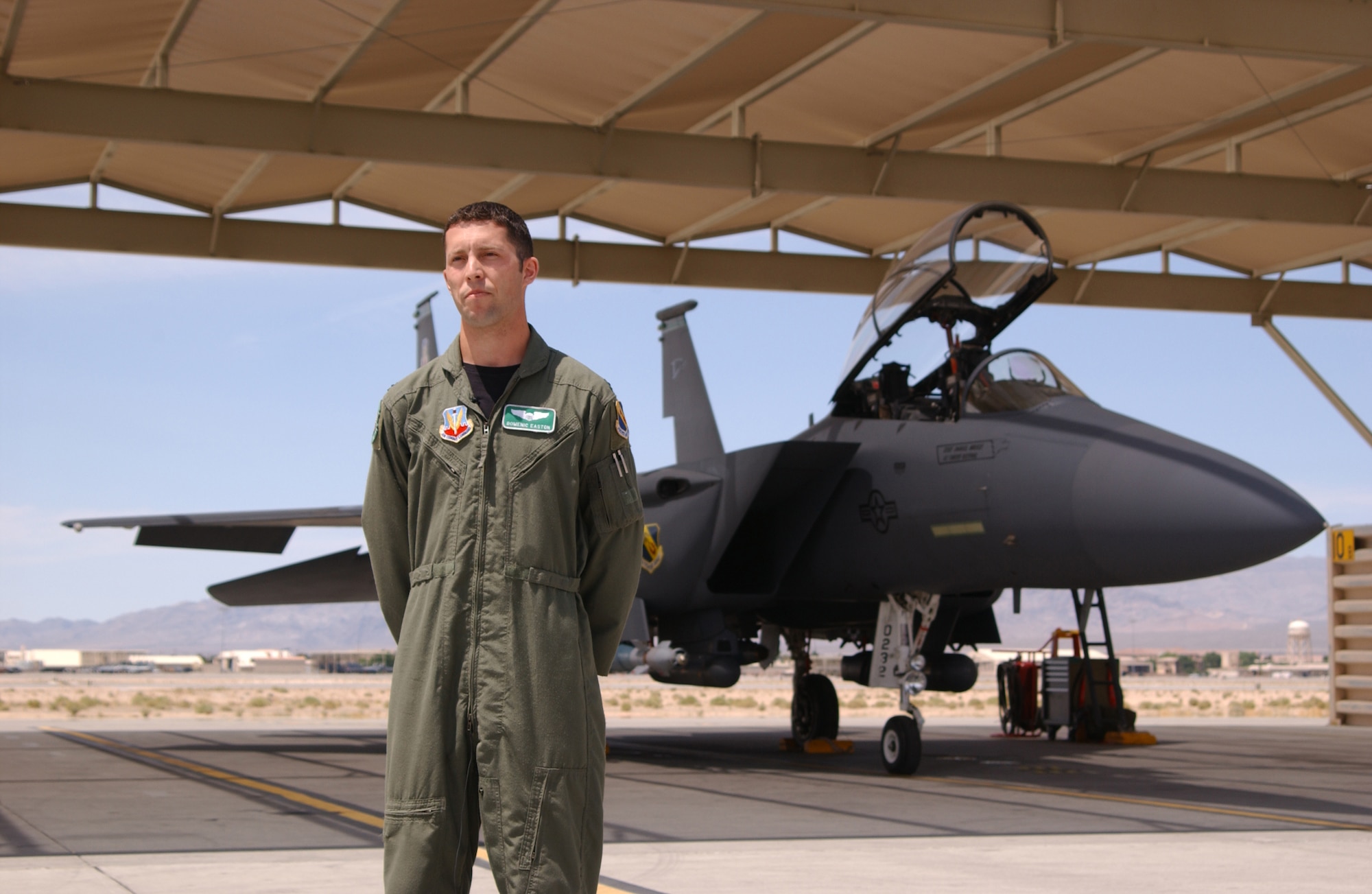 1st Lt. Domenic Easton, F-15E pilot, participated in Green Flag-West 07-07.  The pilot is preparing for his first deployment in the Global War on Terrorism. He said, "Exercises like Green Flag help us integrate with our sister squadrons and other assets such as Predator, Reaper and the helicopters from the Army and obviously the guys on the ground ... it has been excellent in incoprorating all different aspects of CAS for me." (U.S. Air Force photo by Staff Sgt. Jeremy Smith)                               