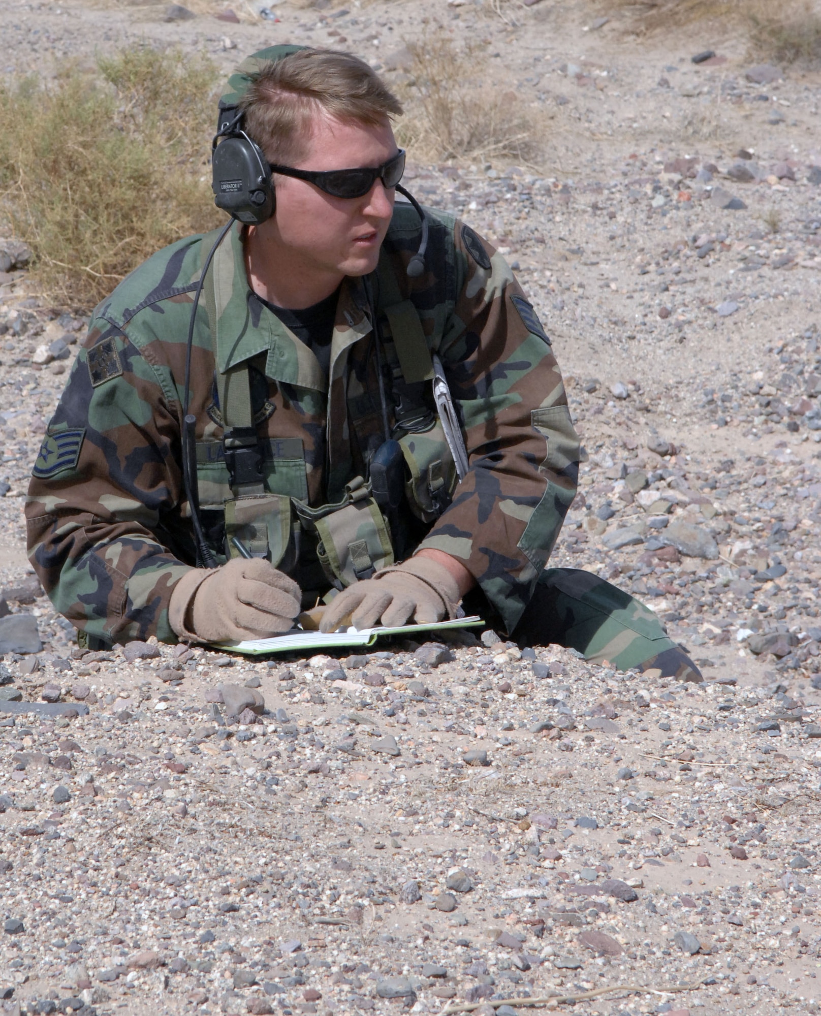 Staff Sgt. Jeff Lawrence, 12th Combat Training Squadron Joint Terminal Attack Controller and observer/controller, simulates calling in an air strike at the National Training Center at Fort Irwin, Calif., May 2, 2007. (U.S. Air Force photo by Staff Sgt. Jeremy Smith)