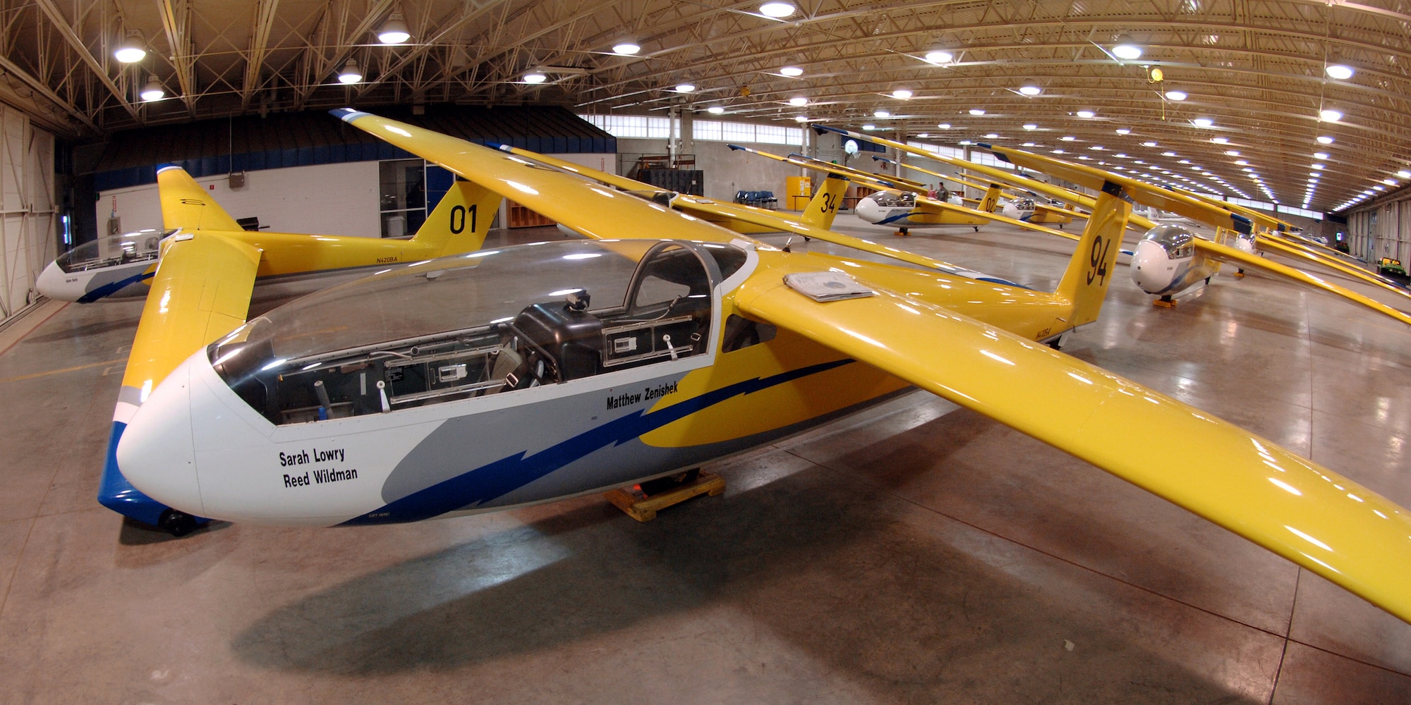 TG-10B gliders are sheltered in a hangar on the flightline at the U.S. Air Force Academy, Colo. The TG-10B (L-23 Super Blanik), a conventional, two-place tandem, basic training sailplane, is used to introduce Air Force cadets to flight through the Soar-For-All program. Maneuvers flown in the TG-10B include aerotow, stall recoveries, slow flight, steep turns and rectangular traffic patterns. (U.S. Air Force photo/David Armer)
