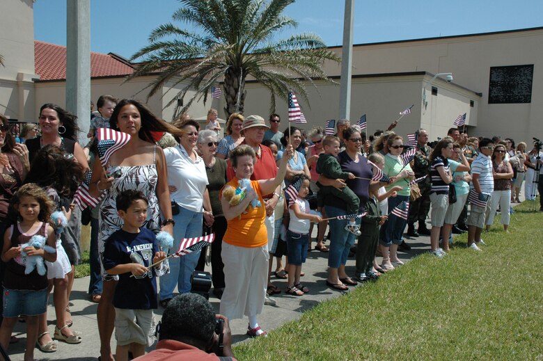 Family members of Air Force Reserve Combat Search and Rescue Airmen anxiously await their return after a deployment to Afghanistan for various lengths of time.  pararescuemen, combat rescue officers, HH-60G Pave Hawk aircrew members and maintainers and various support personell were part of the Rescue force providing combat search and rescue.