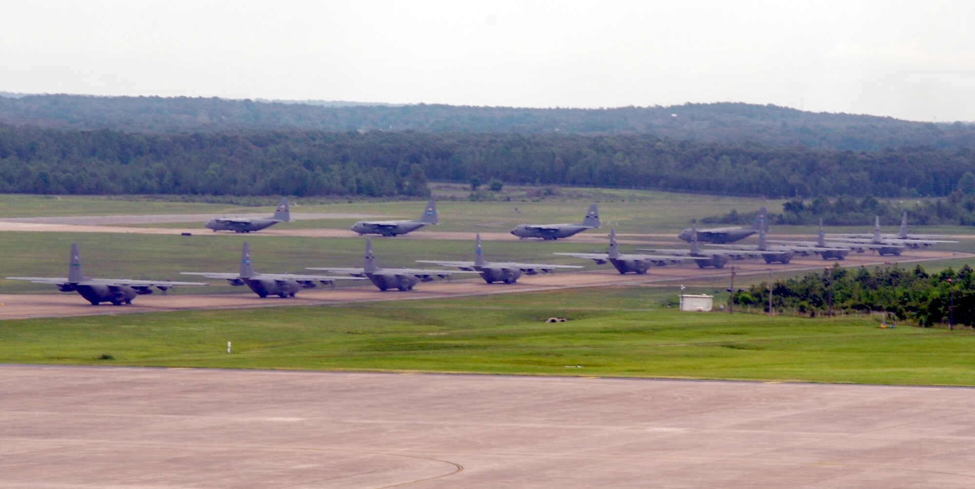 Little Rock Air Force Base C-130's taxi the flight line during an exercise May 11, 2007. Fourteen C-130's participated as part of the Air Force Weapons School syllabus for C-130 and C-17  Weapons Instructor Courses. (U.S. Air Force photo by Airman Vanessa Dale)