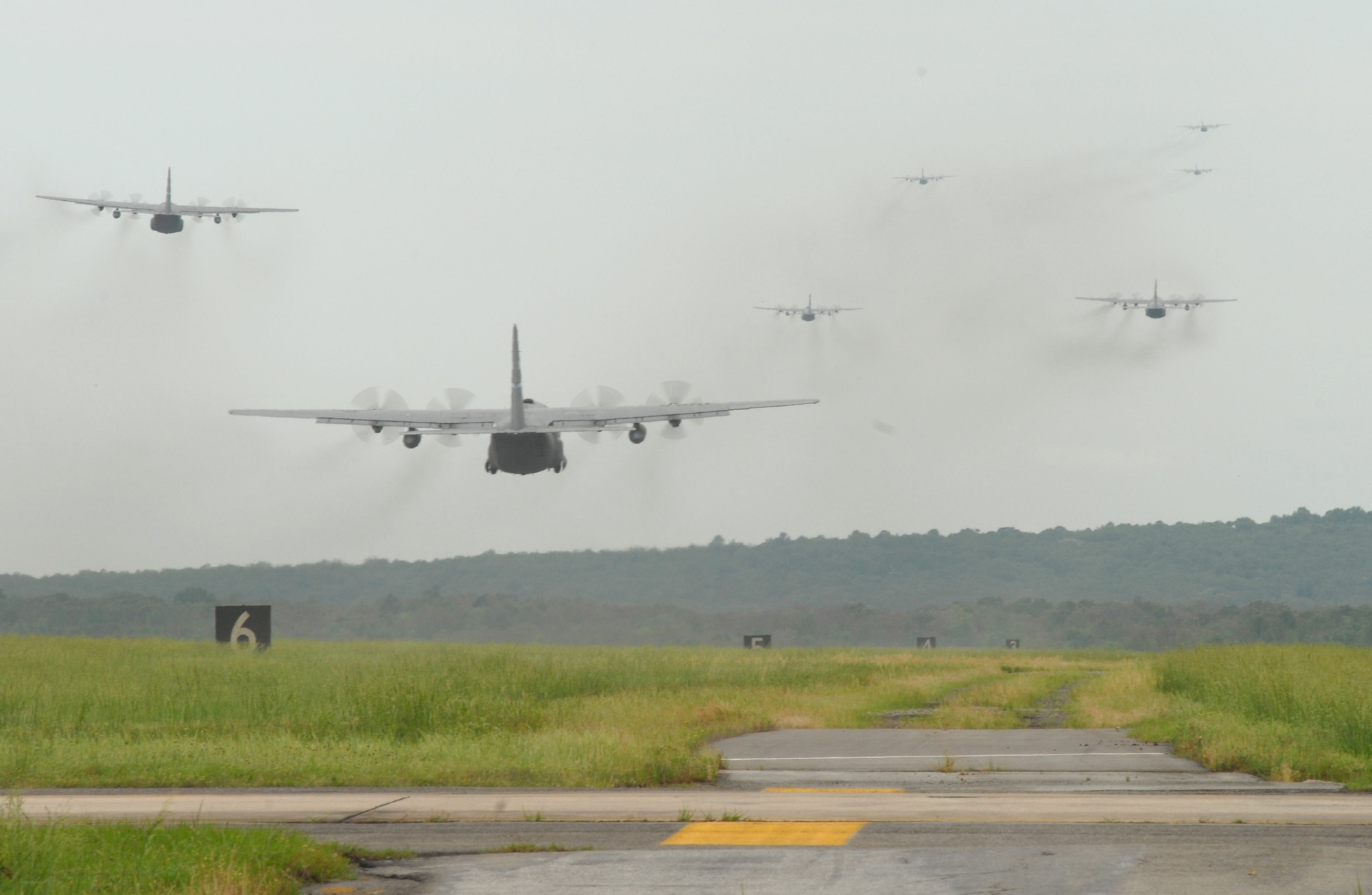 Little Rock Air Force Base C-130's fly in formation during an exercise May 11, 2007. Fourteen C-130's participated as part of the Air Force Weapons School syllabus for C-130 and C-17 Weapons Instructor Courses. (U.S. Air Force photo by Airman First Class Christine A Clark)
