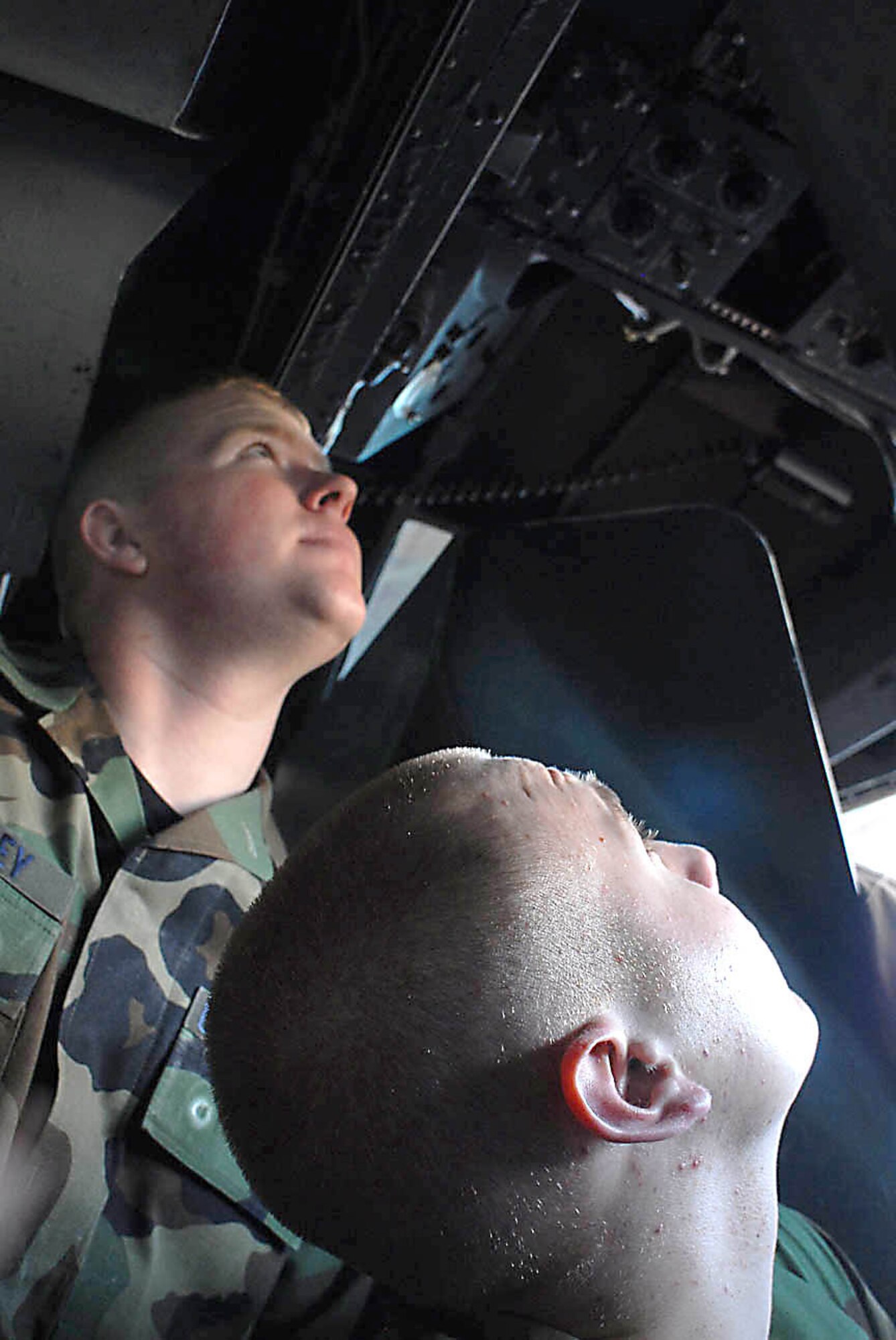 Airman 1st Class Adam Guthrey and Airman Michael Felker practice the fundamentals of inspecting a MH-53M Pave Low IV helicopter. (U.S. Army photo/J. Raynel Bishop Koch)